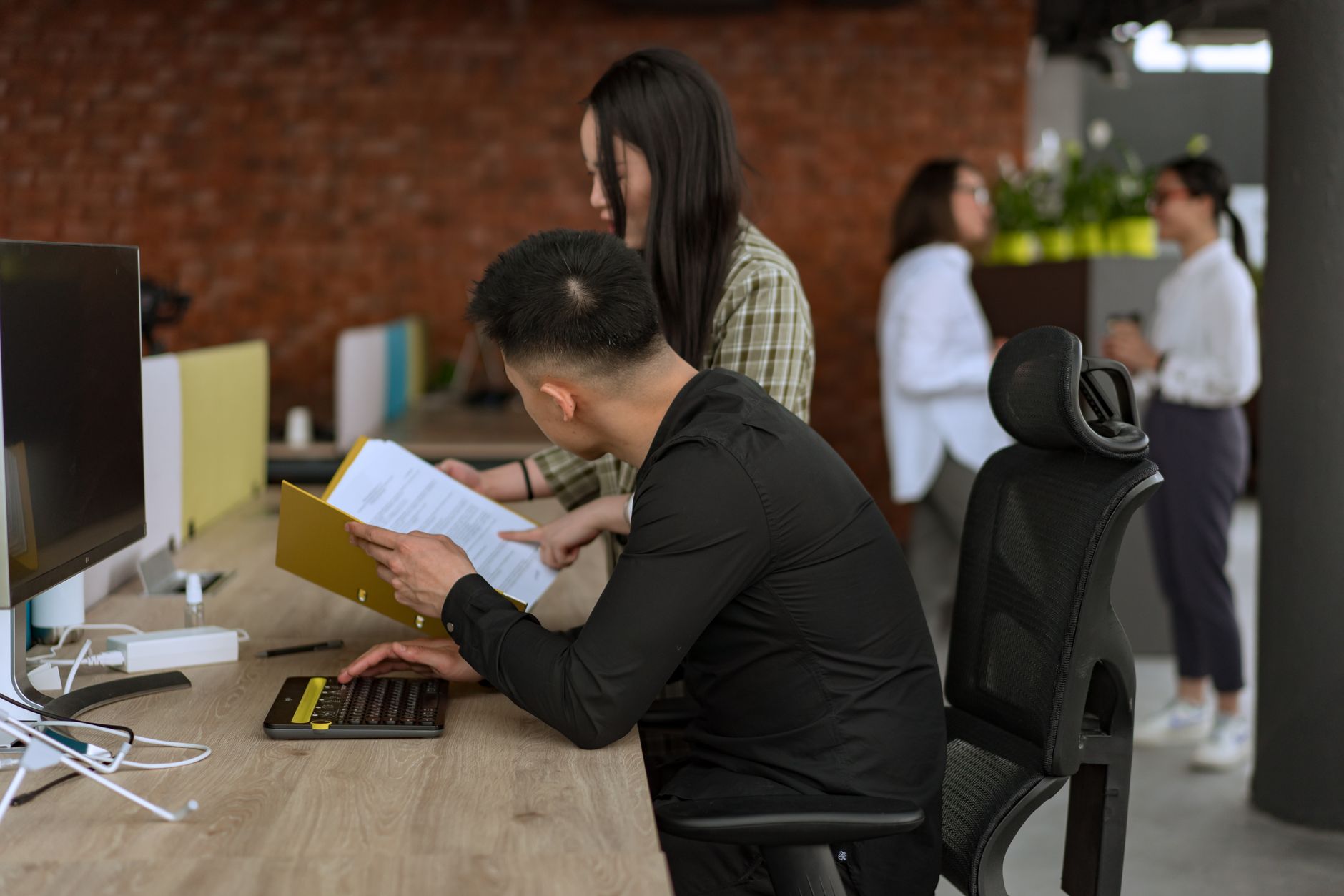 Diverse team collaborating in a modern office setting, enhancing productivity. — The Best Platforms to Receive SMS Online Sec