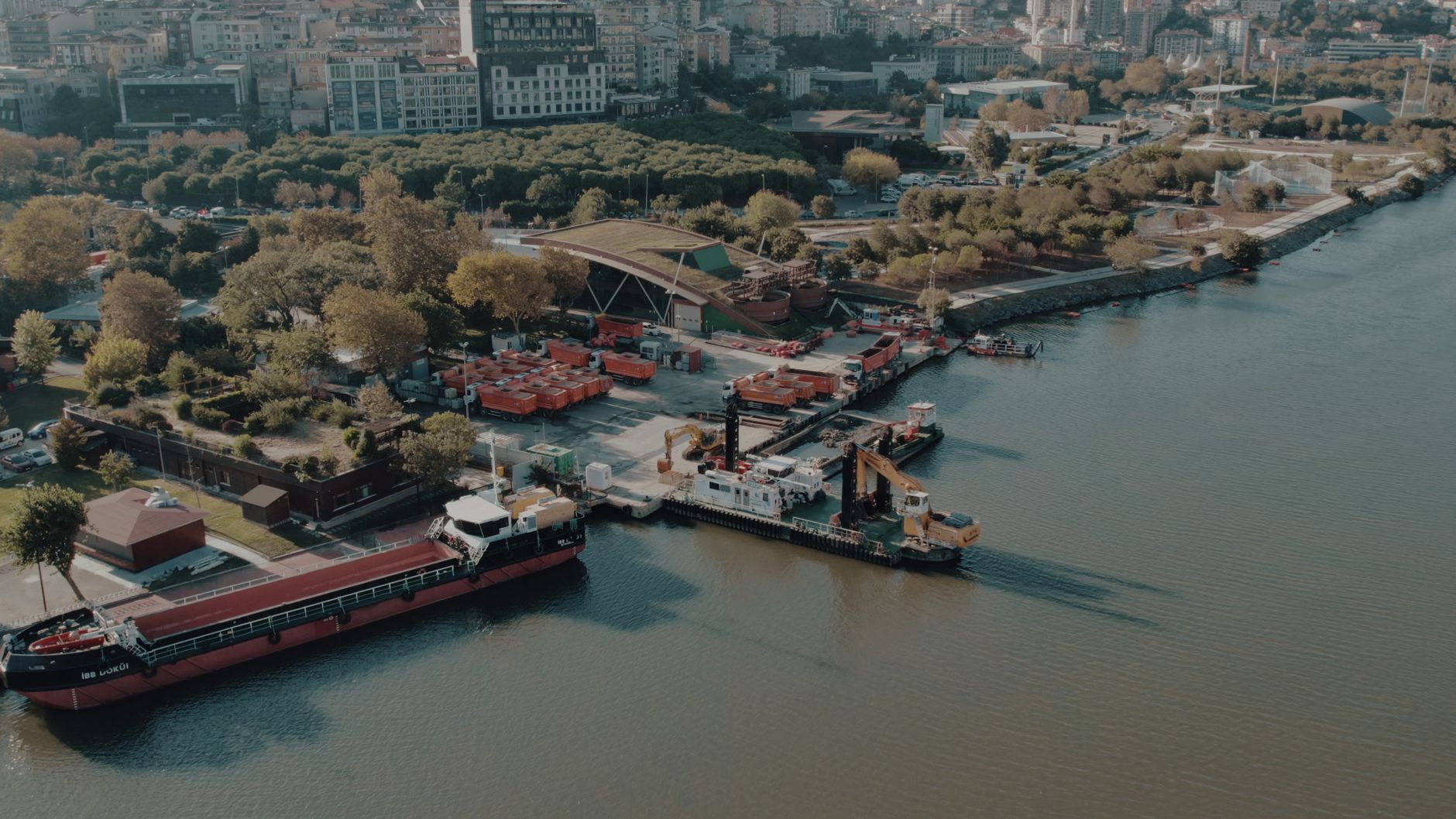 Aerial shot of Istanbul waterfront showing ships docked along a lush green shoreline. — Tinder Phone Verification Solutions w